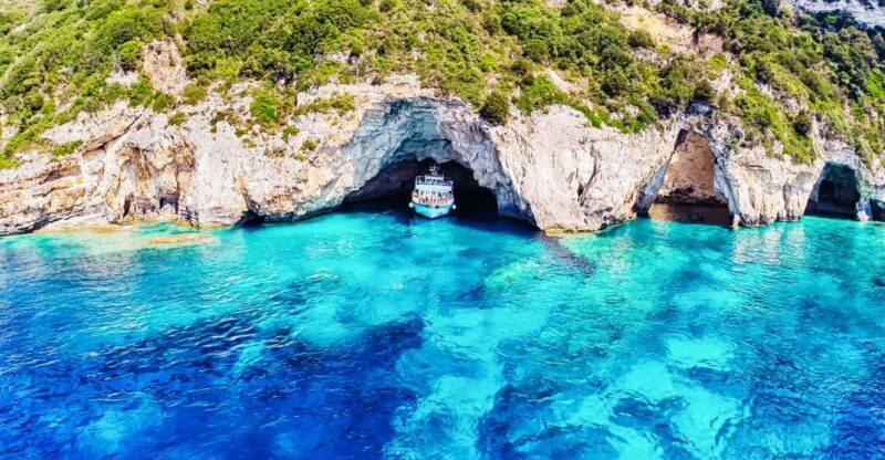 From Corfu: Day Cruise to Paxos, Antipaxos, and Blue Caves - Onboard Entertainment and Local Flavors