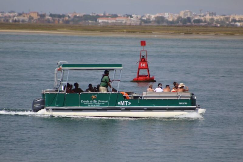From Faro: 2-Island, 2-Stop Ria Formosa Catamaran Tour - Visiting Farol Island: The Lighthouse and Local Community