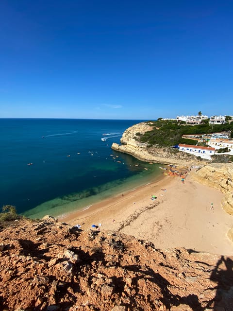 From Faro: Adventure Express Tour - Cliff Jump & Beach - Relaxing at Marinha Beachs Vivid Waters