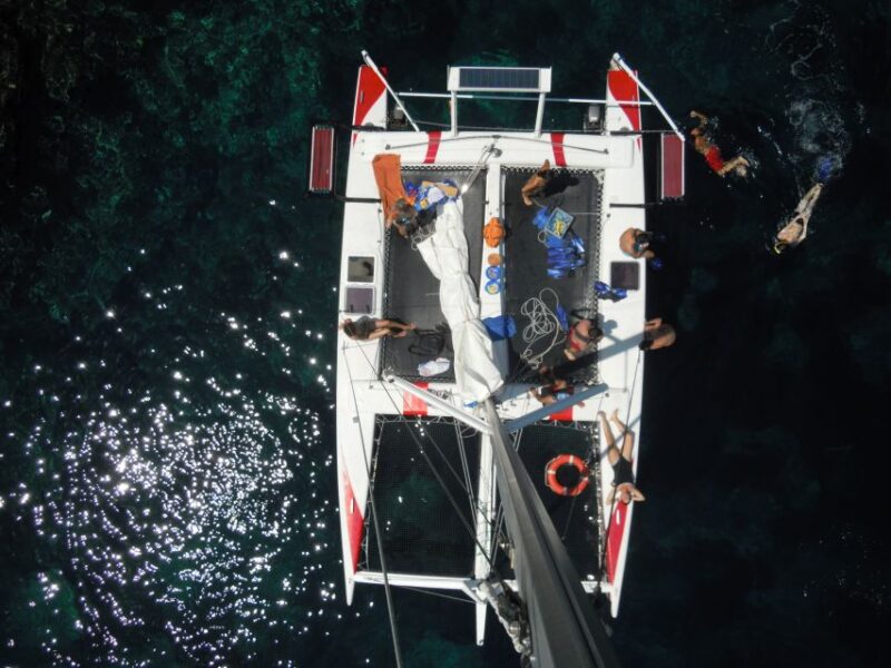 From Fornells: Half-Day Menorca Catamaran Trip w/ Snorkeling - All-Inclusive Drinks and Tasty Snacks Onboard