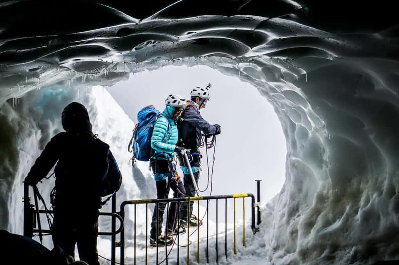 From Geneva: Chamonix, Mont Blanc & Ice Cave Guided Day Tour - Descending to Chamonix and Visiting the Mer de Glace Glacier