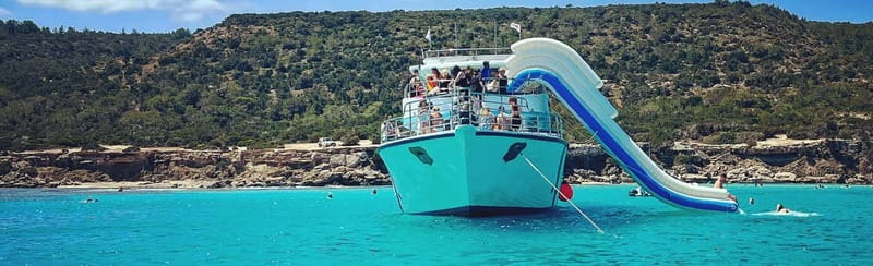 FROM LATCHI: Blue Lagoon Akamas Cruise - large water slide - Relaxing on the Sun Deck or in the Shade