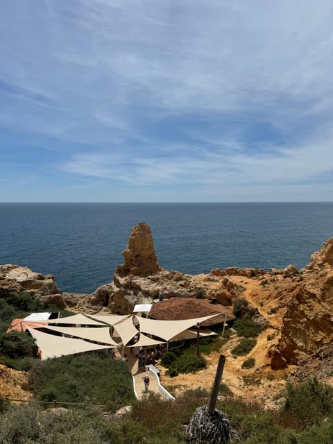 From Lisbon:Day trip to Algarve with Hotel pickup(private) - Exploring Carvoeiro and Algar Seco’s Dramatic Cliffs