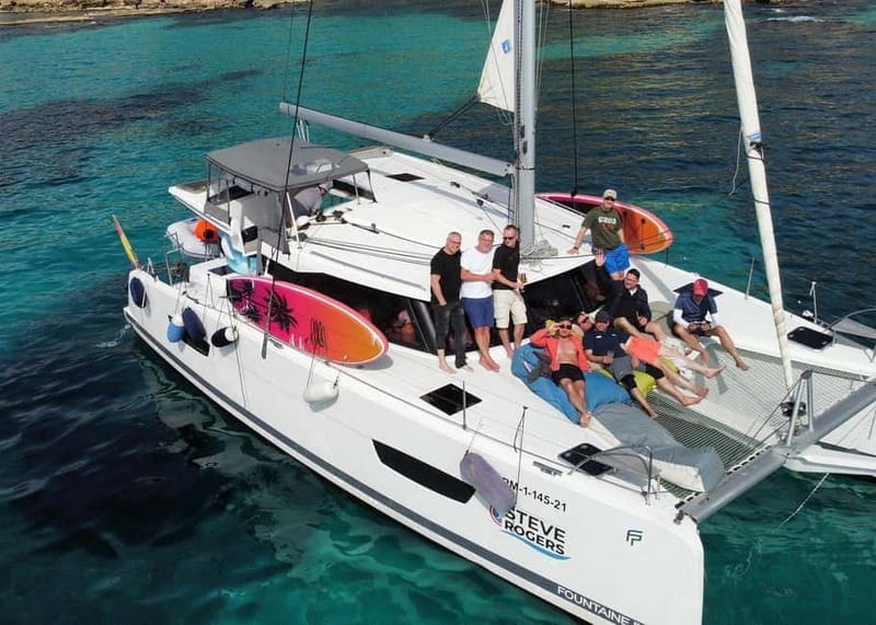 From Palma: Luxury Catamaran Group Tour with Tapas & Drinks - The Crew and Guide Experience