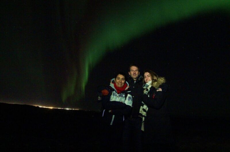 From Reykjavík: Northern Lights Tour with Hot Cocoa & Photos - The Stops Include a Scenic Viewpoint and Smooth Return