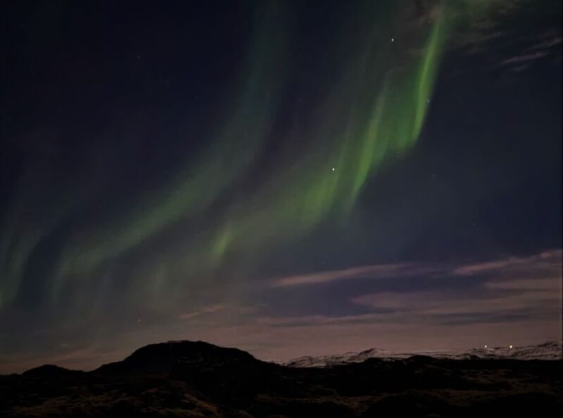 From Reykjavík: Spot the Northern Lights with Snacks & Drink - Warm Up with Hot Chocolate and Icelandic Snacks