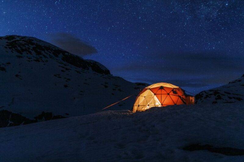 From Skjeggedal: Trolltunga Sunset Winter Overnight tour - The Evening in the Mountain Dome: Food and Night Sky
