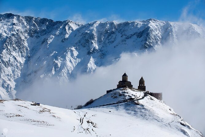 From Tbilisi Daytrip Kazbegi Gudauri & Zhinvali Guided Group Tour - Visiting Gergeti Trinity Church with a Mountain Backdrop