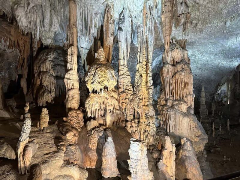 From Trieste: Postojna Cave & Predjama Castle Tour - Discovering the Wonders of Postojna Cave on a Scenic Train Ride
