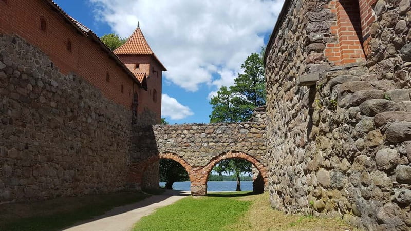 From Vilnius: Trakai Castle and Paneriai Memorial Tour - Exploring Trakai Castle on the Island