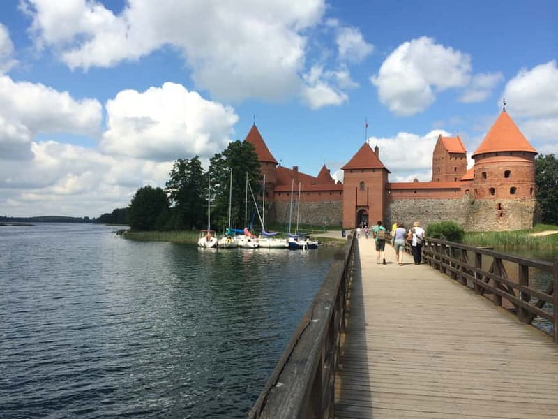 From Vilnius: Trakai Castle and Paneriai Memorial Tour - Highly Praised Guides and Service