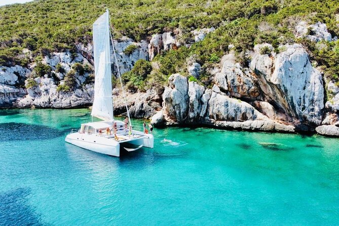Full day Catamaran cruise in Porto Conte Natural Park - Booking, Cancellation, and Weather Considerations