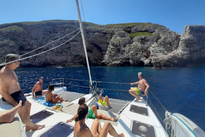 Full day catamaran tour in Alghero - Practical Details: Meeting Point and Timing