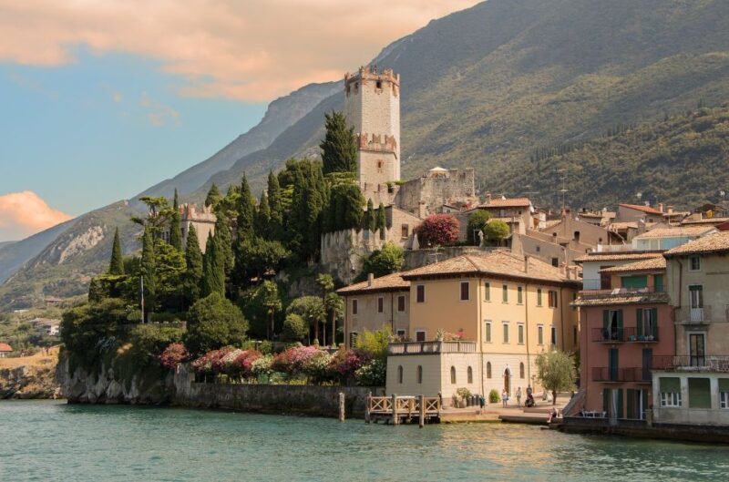 Full-Day Lake Garda Tour: Bus & Public Boat with Guide - Scenic Boat Ride: A Highlight of the Tour