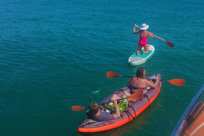 Full day private yacht from lagos with drinks, tapas, paddle boards and kayak - The Scenic Route: Sagres or Benagil Caves