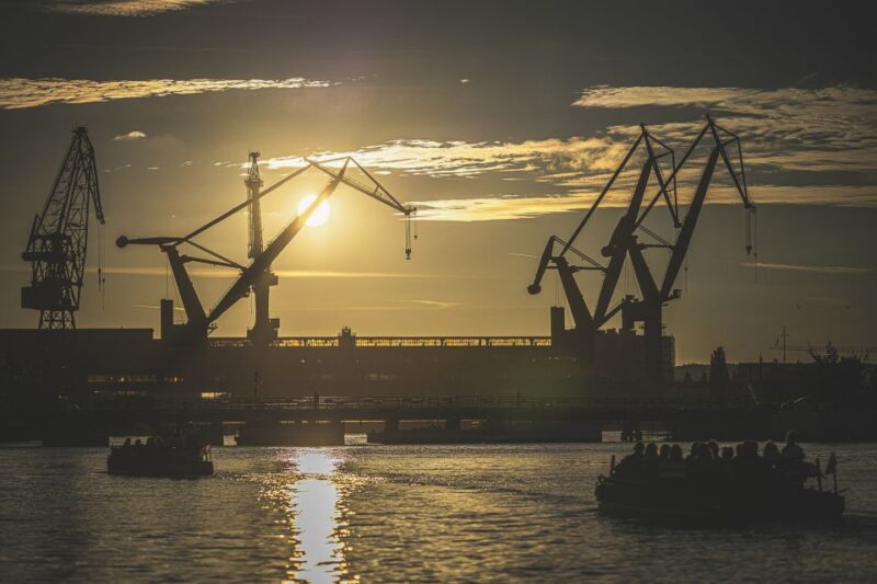 Gdask: Sunset Cruise on a Historic Polish Boat - Sunset Over Gdansks Historic Shipyard and Crane