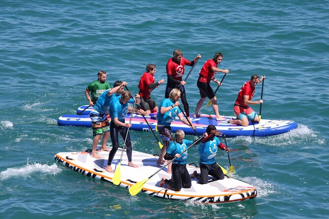 Giant Stand Up Paddle Boarding Experience in Newquay - Launching on the Coastline at Newquay Activity Centre