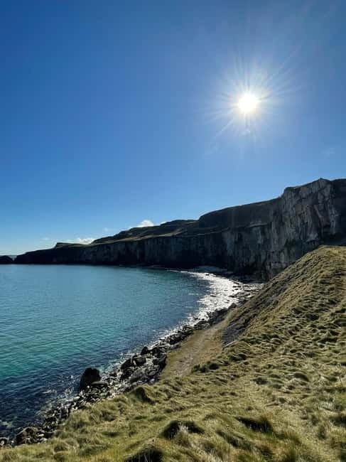 Giants causeway & Belfast private tour - Historic Dunluce Castle: A Picturesque Ruin with a Story