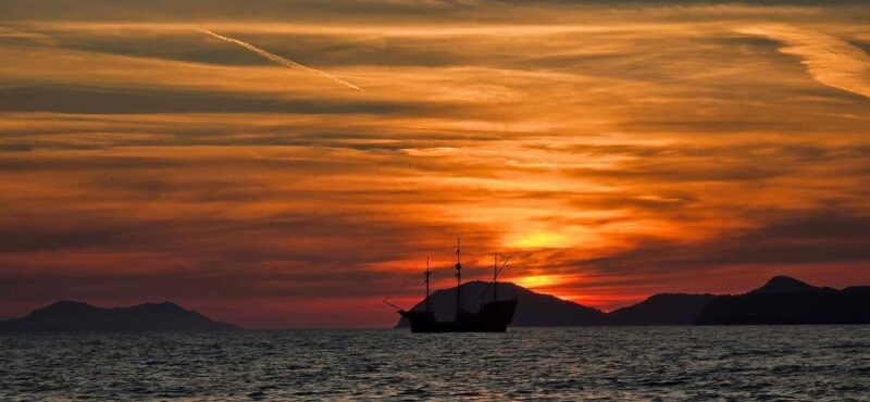 Glassboat sunset tour around Old Town & Caves in Dubrovnik - Exploring Lokrum Island at Dusk