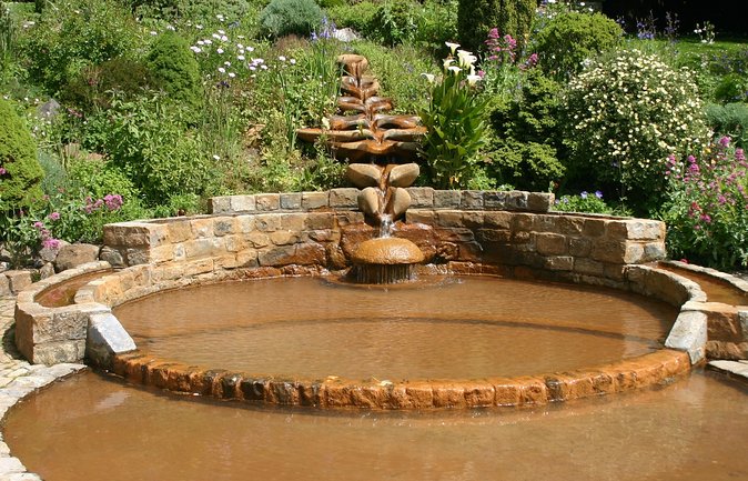 Glastonbury and Cheddar Gorge Guided Day Tour from London - Climbing to Glastonbury Tor and Its Significance