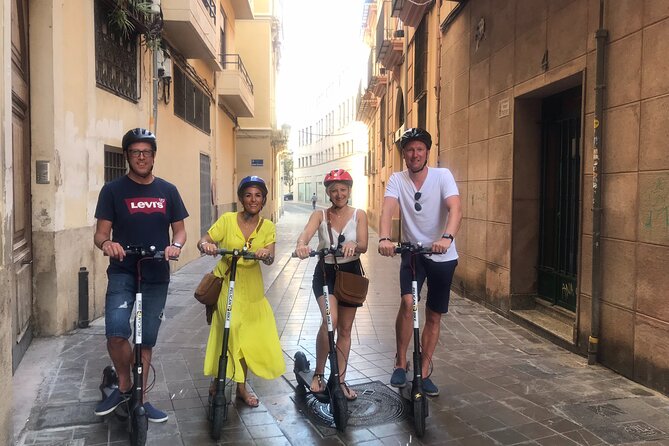 Grand City | Small Group Bike Tour through Top Highlights - Walking Through the Serranos Towers