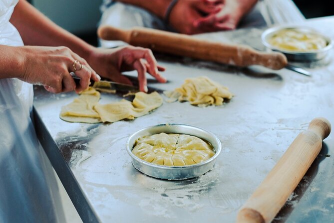 Greek Cooking Class in Athens Including Rooftop Dinner with Acropolis View - The atmosphere and group dynamics