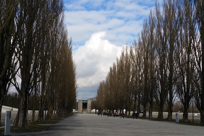 Guided Dachau Concentration Camp Memorial Site Tour with Train from Munich - Who Guides Are and How They Enhance the Experience