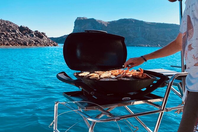 Half-Day Exclusive Catamaran Cruise in Santorini with Meal and Open Bar - Practical Details and Booking Insights