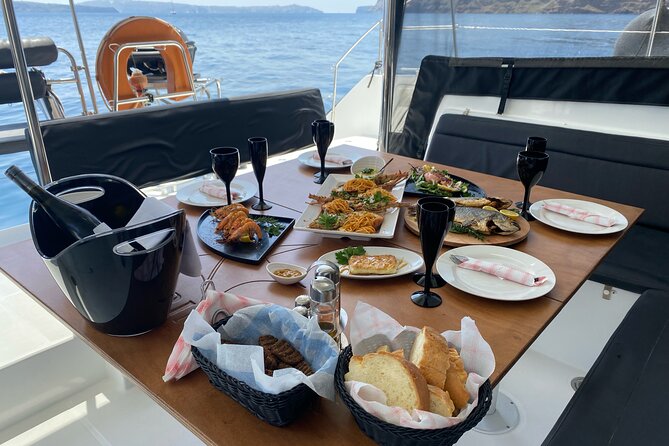 Half Day Premium Catamaran Cruise in Santorini including Oia - Gourmet BBQ Dinner and Open Bar on Board