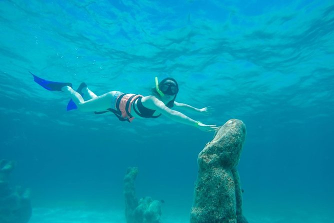 Half Day Sailing Private Catamaran to Isla Mujeres - Island Exploration and Optional Activities