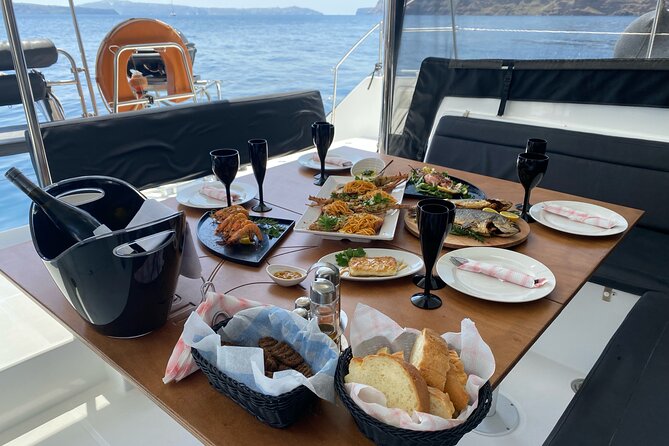 Half-Day Tailor-made Private Catamaran Cruise in Santorini - Unique Stops at Red Beach and Thirassia
