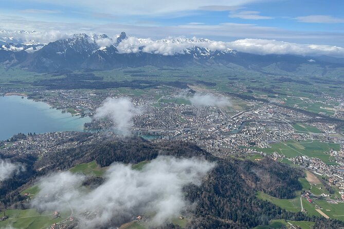 Helicopter tour to the Stockhorn mountain, with great view to the Swiss Alps - The Iconic Niesen Mountain and Its Triangular Shadow
