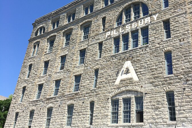 Historic Minneapolis Riverfront Private Walking Tour - Crossing the Historic Stone Arch Bridge