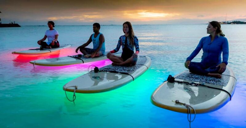 Honolulu: Night SUP Yoga Class - Practicing Yoga on a Paddleboard in Honolulu