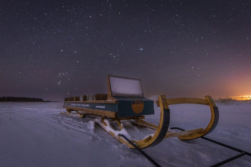 Ii: Snowmobile sleigh trip on frozen sea under starlit sky - The Scenic Ride: Snowmobiles and Sleighs
