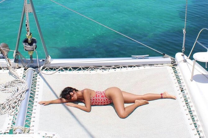 Isla Mujeres Catamaran Day Trip from Cancun with Snorkeling - Landing on Isla Mujeres and Access to a Beach Club