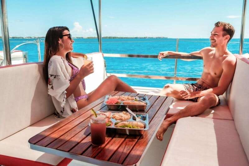 Isla Mujeres Plus Experience Catamaran Tour + Snorkel+Lunch - Free Time on Isla Mujeres: Beaches and Towns