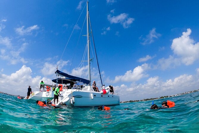 Isla Mujeres Tour on Catamaran with Snorkel, Open Bar, Buffet & Beach club - Sunset Views and Return Journey
