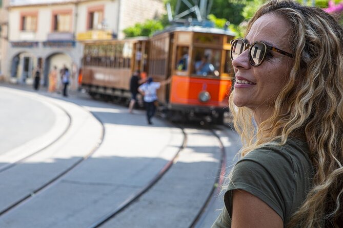 Island Tour with Train Tram Boat and Bus from Cala Millor - Key Points