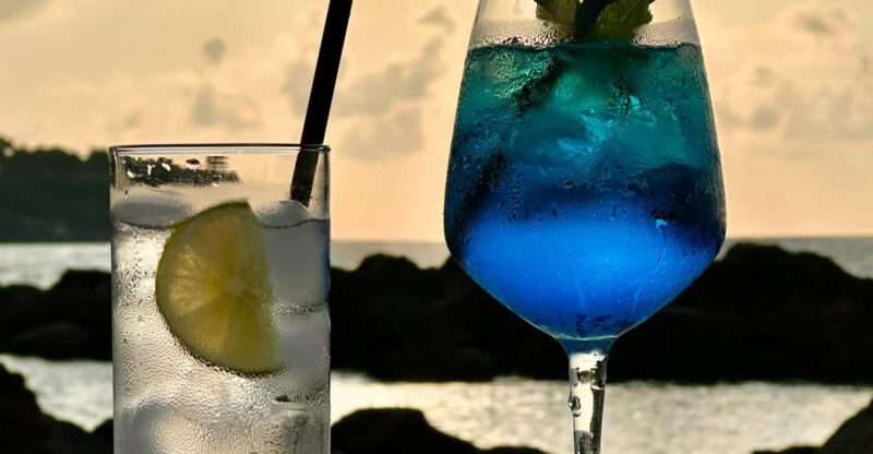 Italian aperitif at the sunset by the sea - The Lounge and the View of Ischia Porto Lighthouse