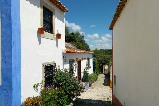 Jewish Heritage Private Tour: Óbidos and Tomar from Lisbon 9H - Climb Óbidos Castle for Panoramic Views and Local Ginjinha