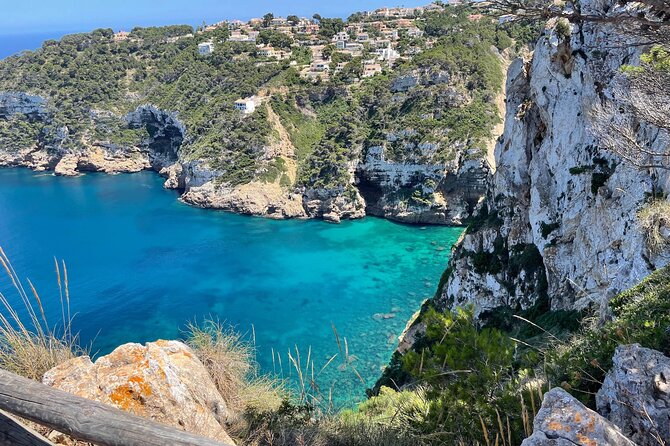 Kayak Paradise: Cala Portixol Snorkel, Cave & Cliff Jumping Tour - Isla de Portixol: Caves, Lagoon, and Cliff Jumps