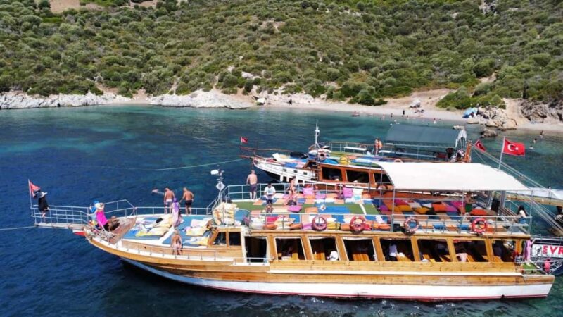 Kuadas: Boat Tour with Swimming, Lunch, and Soft Drinks - Relaxing on Deck and Sunbathing in the Aegean Sun