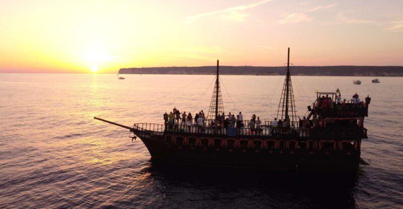 Lampedusa: Sunset Dolphin Sighting on a Pirate Ship - The Charm of Lampedusa’s Coastline from a Pirate Galleon