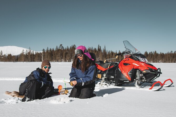 Lappish Lunch Break -Snowmobiling, ice fishing and tasty food - Snowmobiling Across Lapland’s Icy Landscape