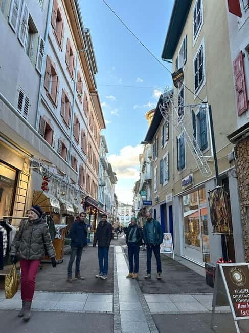 Lausanne: Walking Tour with Chocolate Tastings & Metro - Walking through Lausannes Historic Shopping Streets