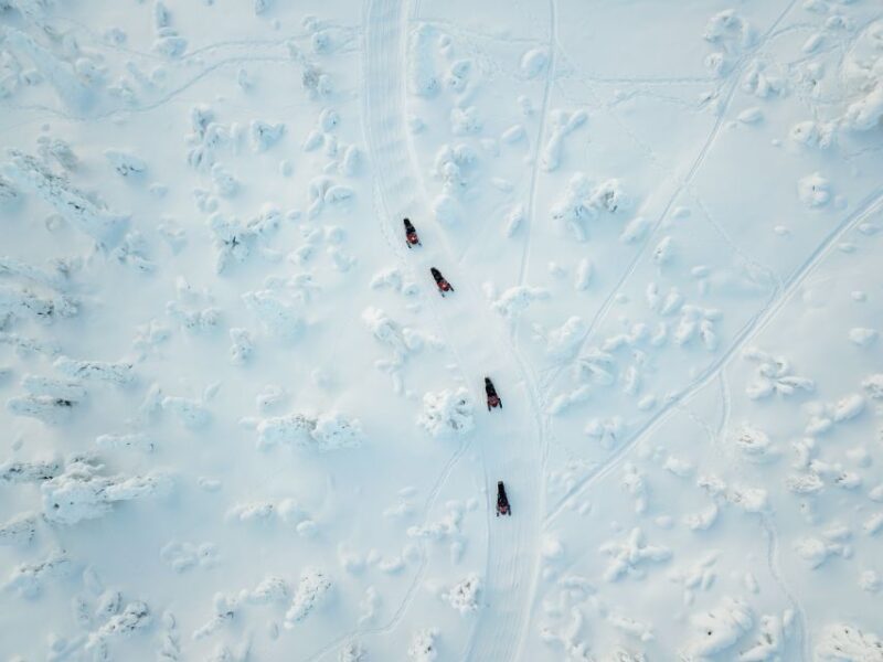 Levi: Snowmobile Safari with Ice Fishing and Outdoor Lunch - Snowmobiling Through Arctic Wilderness on Two-Seat Machines