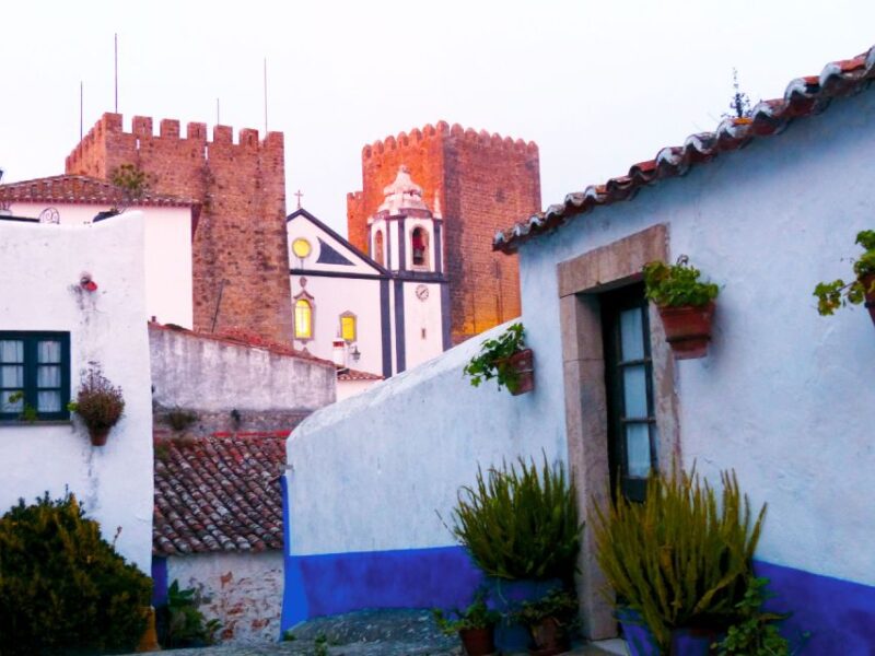 Lisbon: 1-Way Porto Transfer w/Obidos, Nazare & Fatima Stops - Authentic Tasting of Ginjinha in Obidos