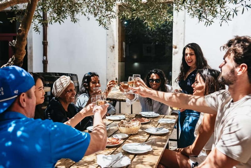 Lisbon: Baixa District Food Tour with Dinner and Drinks - Stops at Historic Squares and Traditional Restaurants