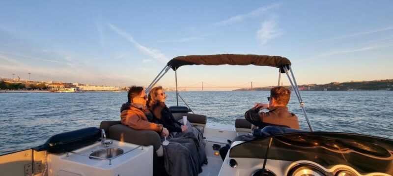 Lisbon: City Boat Cruise Daytime/Sunset/Night with Champagne - Enjoying Champagne and Water Aboard
